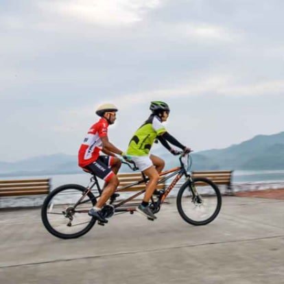 River Front Couple Cycling
